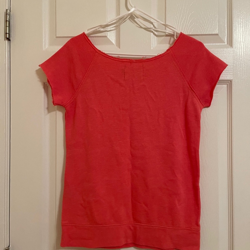 Vibrant volcom top with a bow accent